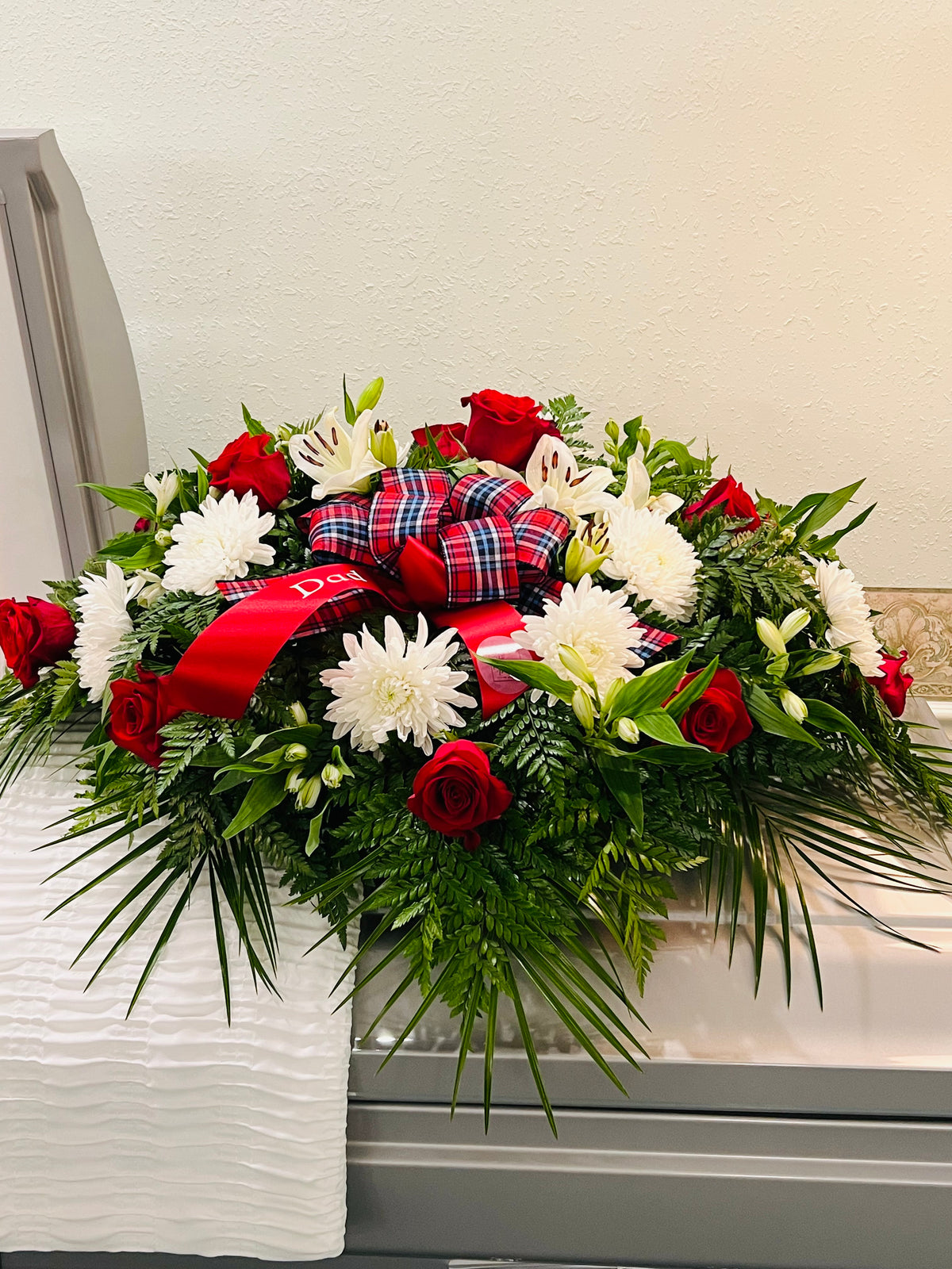 White sympathy floral tribute
